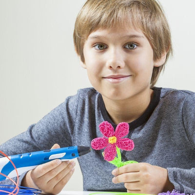 a boy making a flower model from 3d pen printer