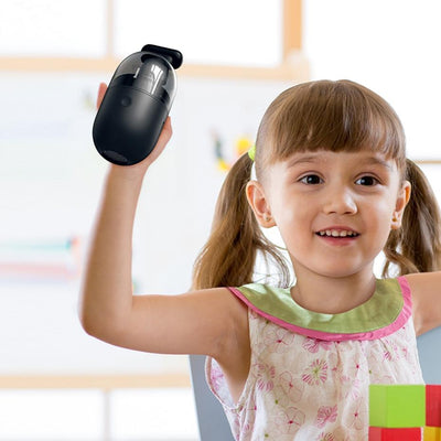 a small girl holding the vacuum cleaner in her hand