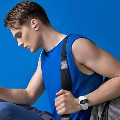 a boy wearing the smartwatch with earbuds
