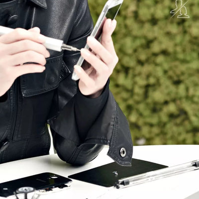 a person using electric screwdriver to repair his phone