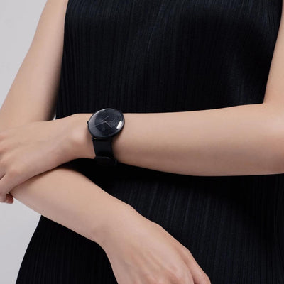 a girl wearing the hybrid smartwatch