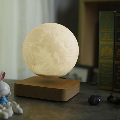 levitating moon lamp with brown coloured base