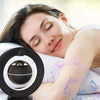 a girl sleeping beside the levitating bluetooth speaker