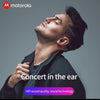 A man wearing Motorola earbuds