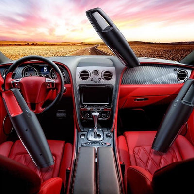 a car with red interior being vacuumed