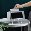 a person taking out napkins from the vintage holder